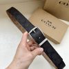 The 3.7cm wide COACH double-sided waist belt is made of one side of black/khaki fabric and c qgca3a2j