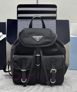 The new backpack 1BZ677A features a silver buckle and a leather edge cover. This nylon backpcjakyms3