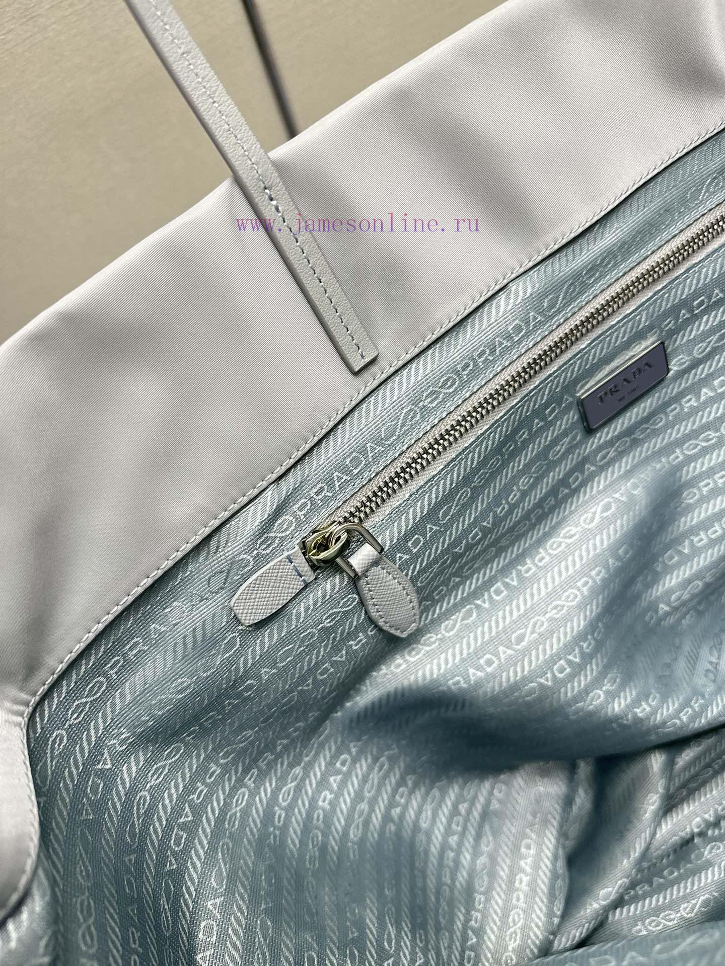 The new shopping bag 1BG107 is a medium-sized tote bag made of innovative recycled nylon fabdj54zvxb - Image 9